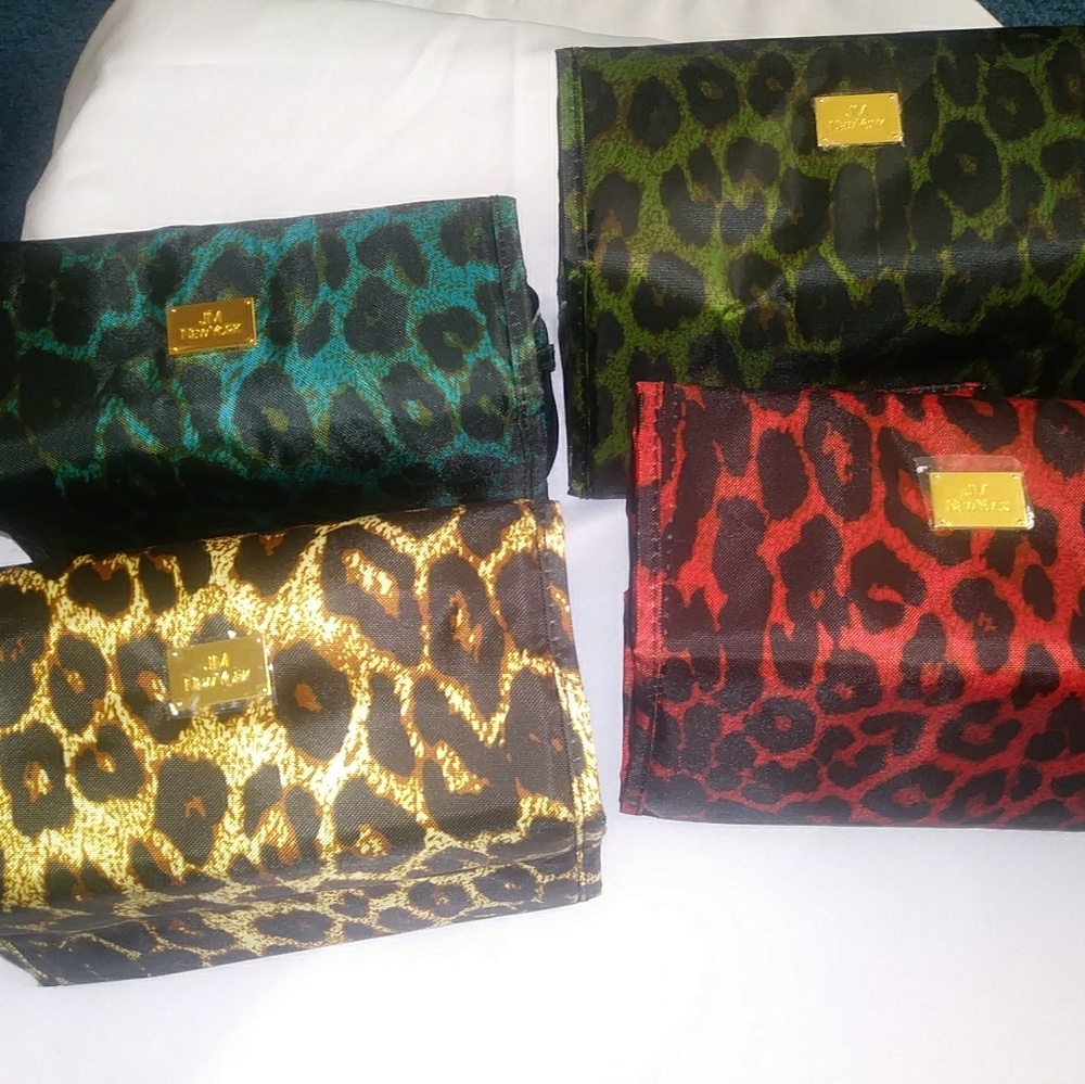 Sold lot of 4 JM New York small make up bags